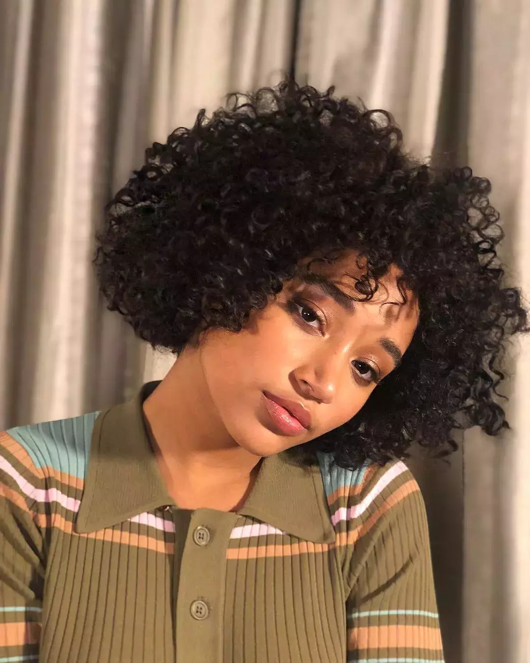 A Curly Bob With Face Framing Pieces